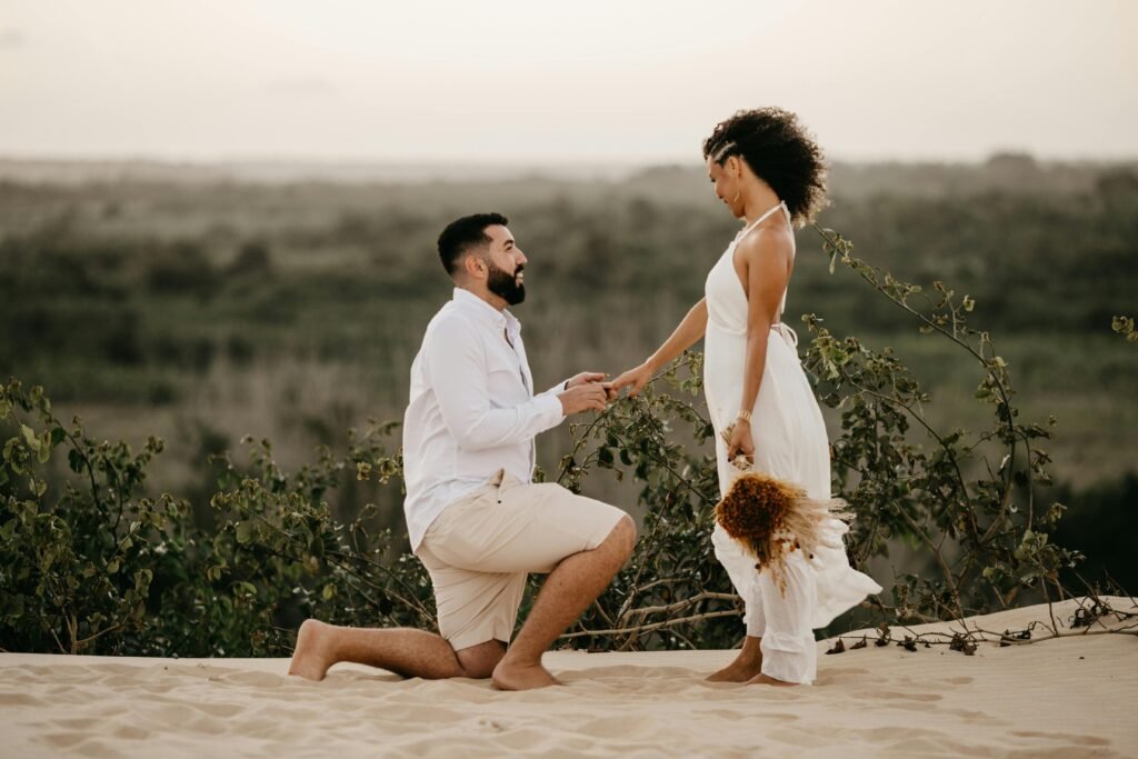 Boy down on one knee happily proposing to his girlfriend.